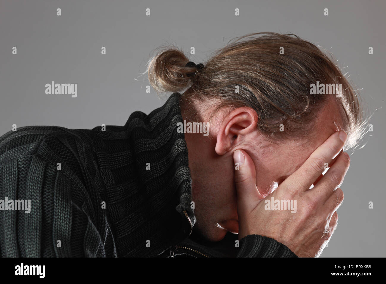 The thoughtful man anxious by problems. Stock Photo
