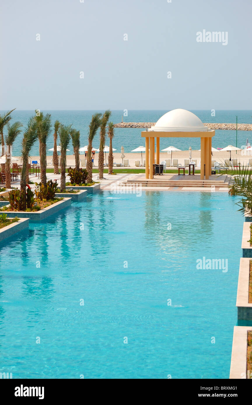 Swimming pool and beach of luxury hotel, Dubai, UAE Stock Photo