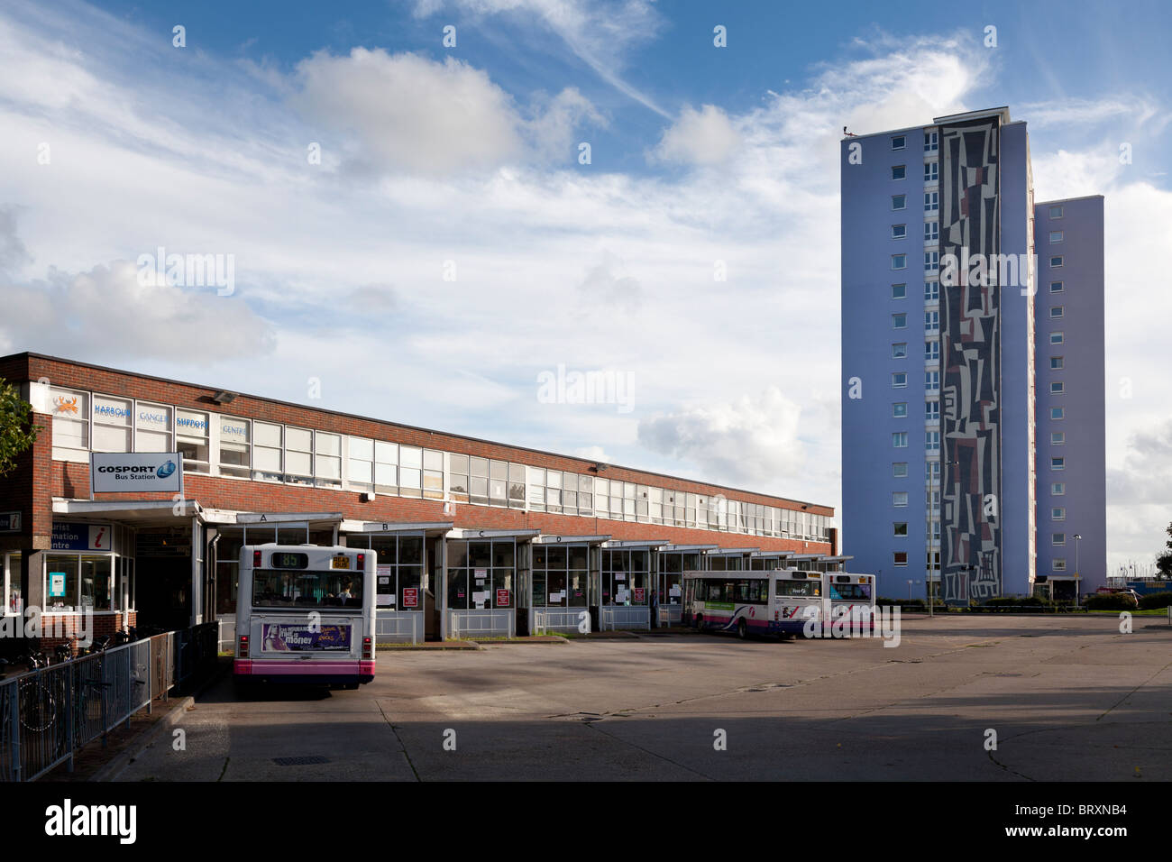 Gosport Bus Station with tower block of flats Stock Photo Alamy