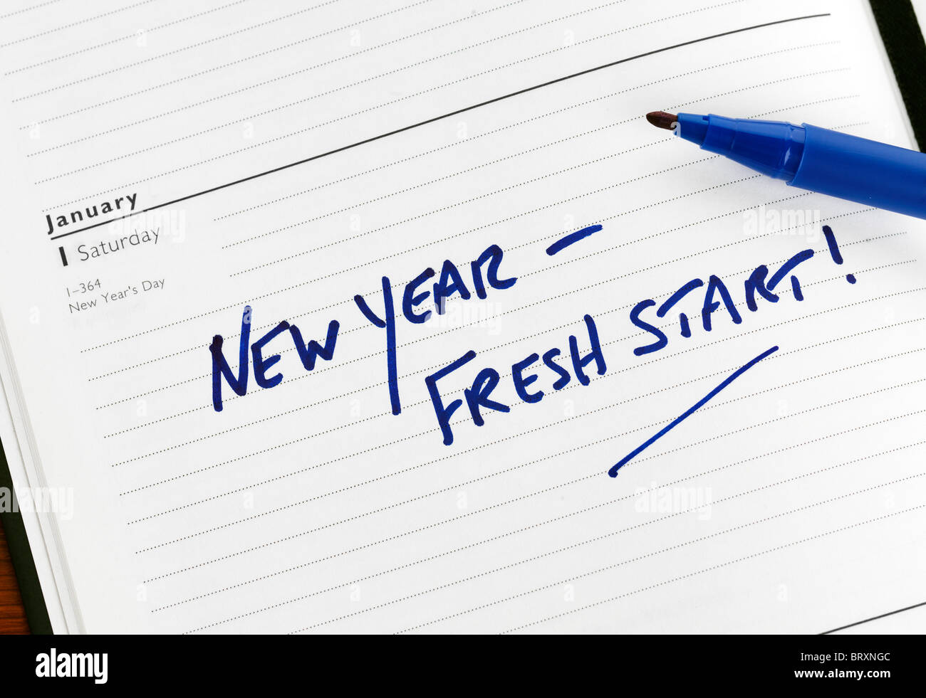 New Year resolution marked in a diary for 01 January Stock Photo