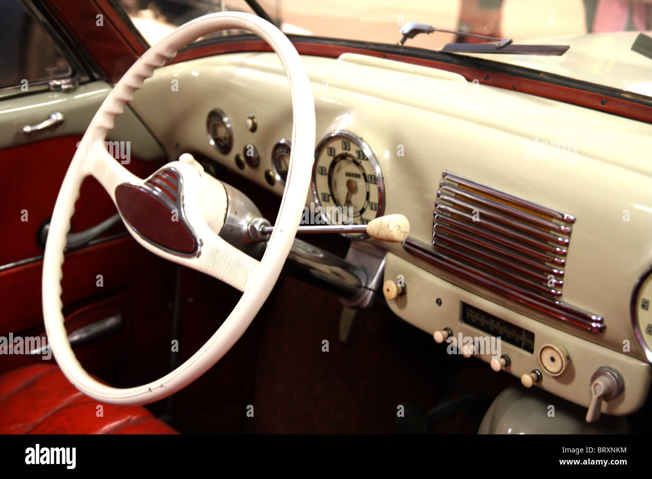 Interior of classic style veteran car with driving wheel Stock Photo