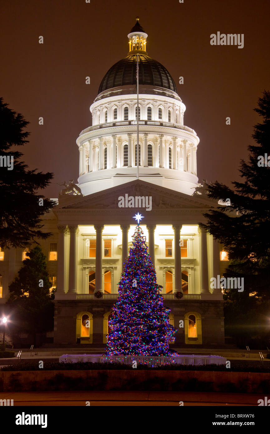A Christmas tree decorates the California State House at dusk in Sacramento. Stock Photo