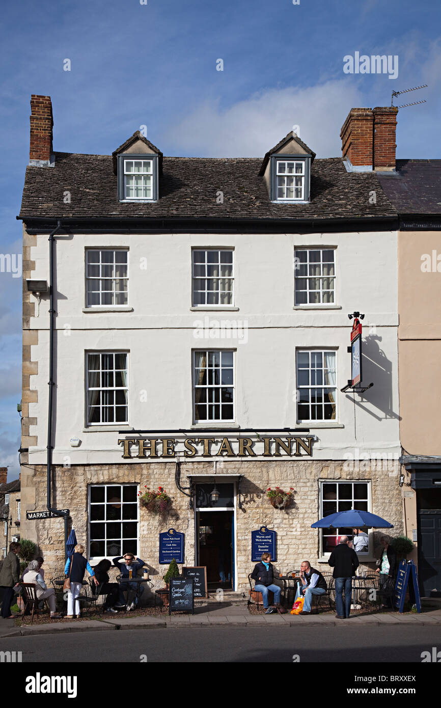 People sitting and drinking outside the Star Inn public house Woodstock Oxfordshire England UK Stock Photo