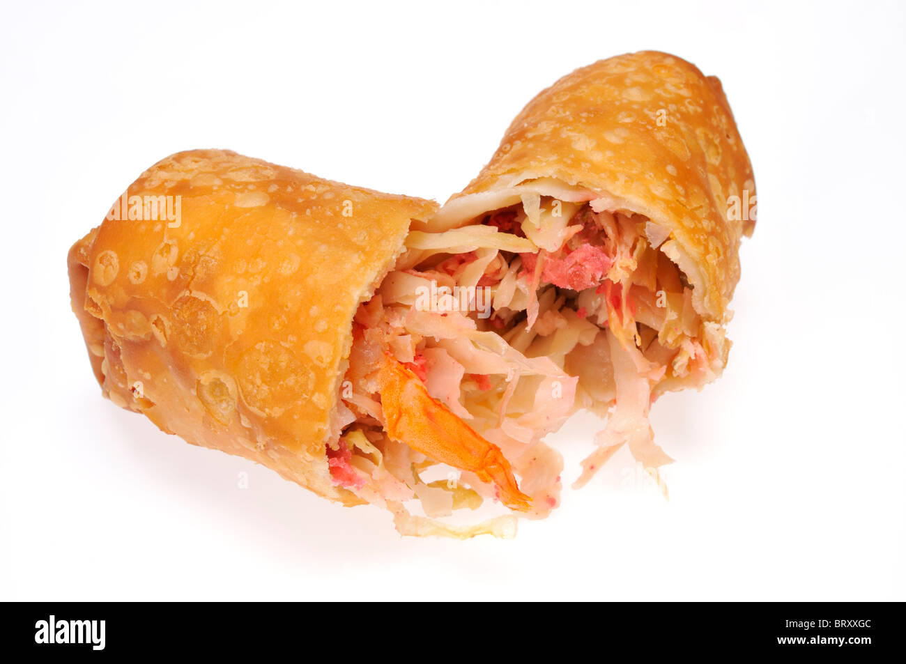 An egg roll cut in half showing its ingredients on white background cut out. Stock Photo