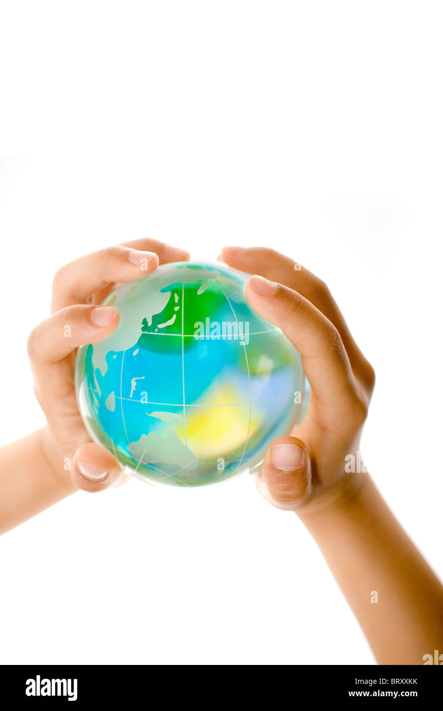 Child holding a glass globe Stock Photo