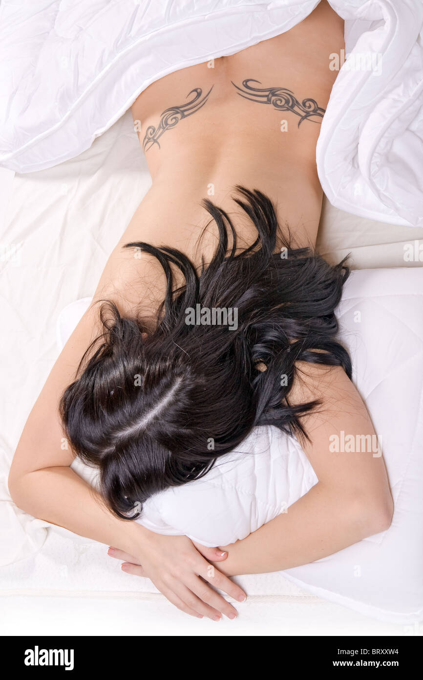 Naked girl sleep on bed Stock Photo - Alamy