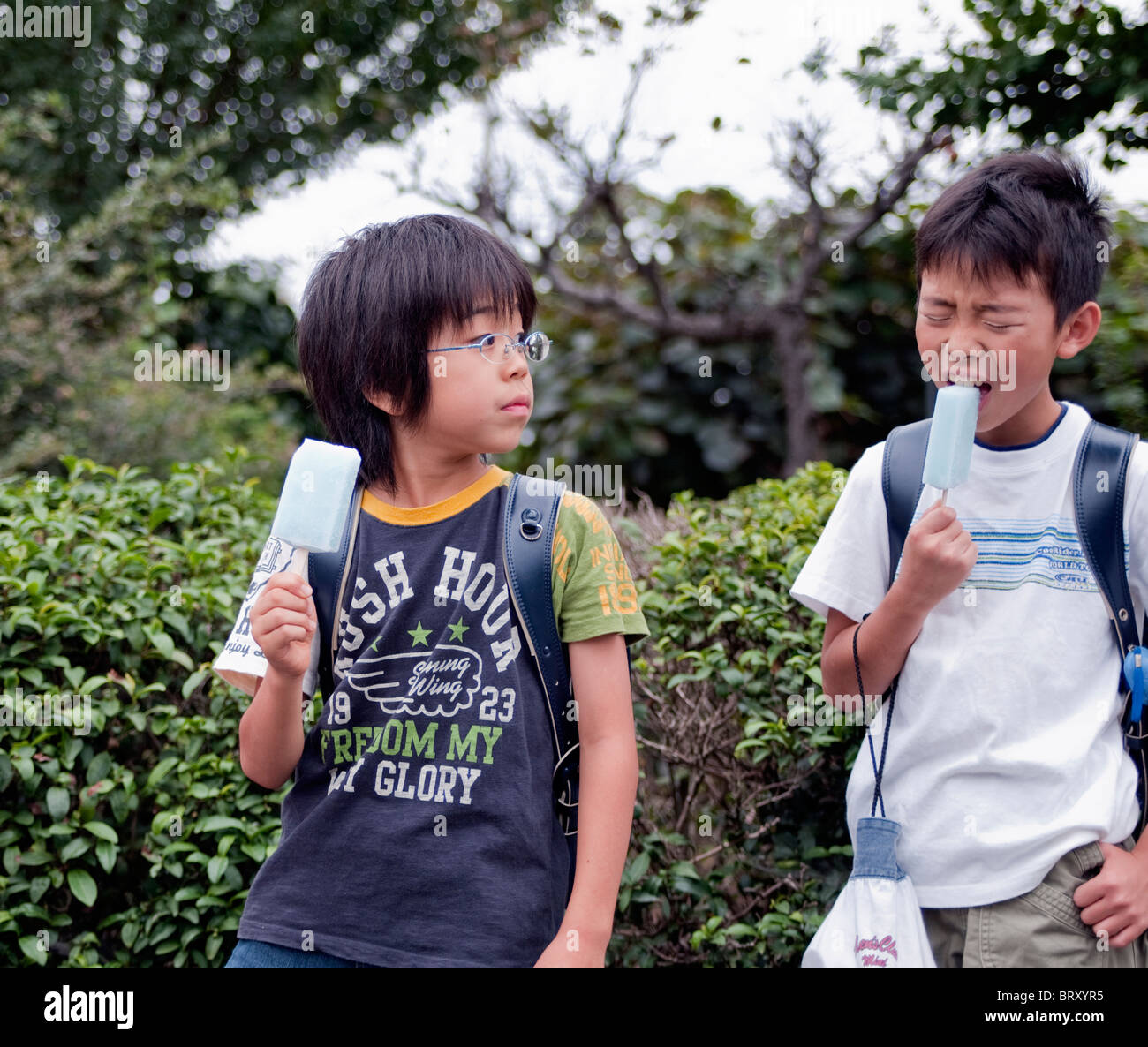 Boys eating popsicles Japan Stock Photo