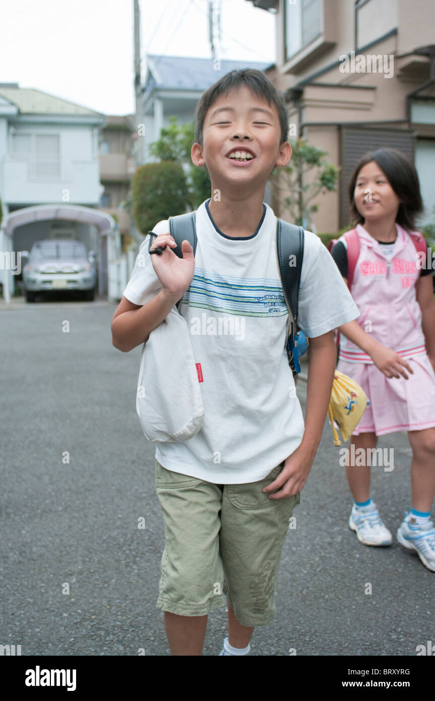 Kids walking home from elementary school Japan Stock Photo