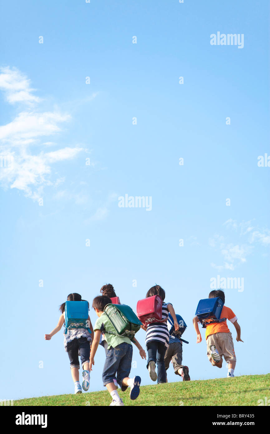 Child Running Fast Rear View Rear view children running group hi-res stock photography and images ...