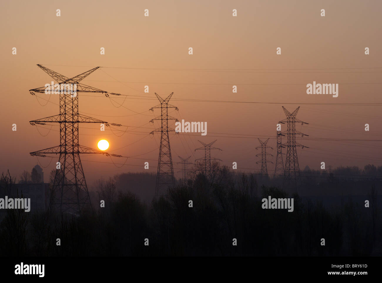High power electrical mast and sun down Stock Photo
