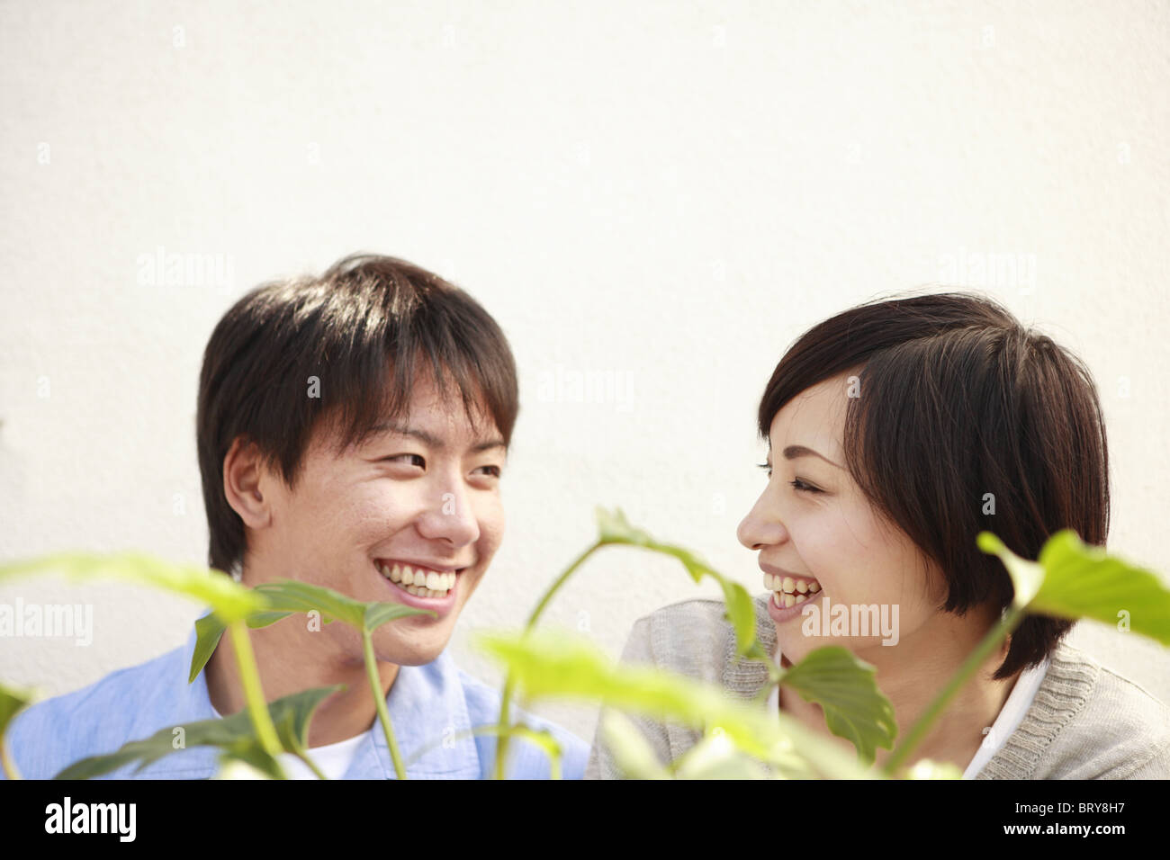 Young Couple Smiling at Each Other Stock Photo