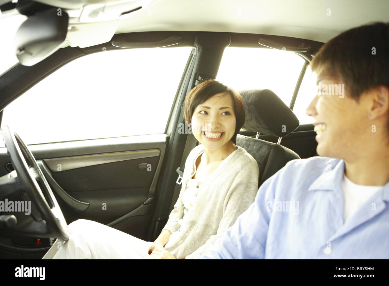 Young Couple Smiling in the Car Stock Photo