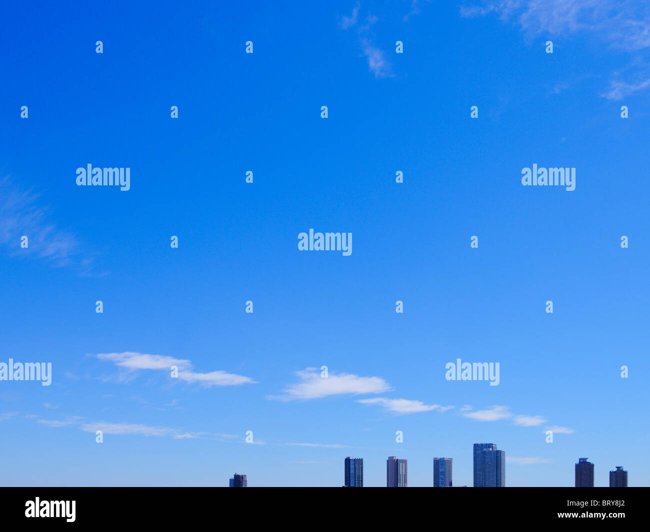 Blue Sky and Tall Buildings Stock Photo - Alamy