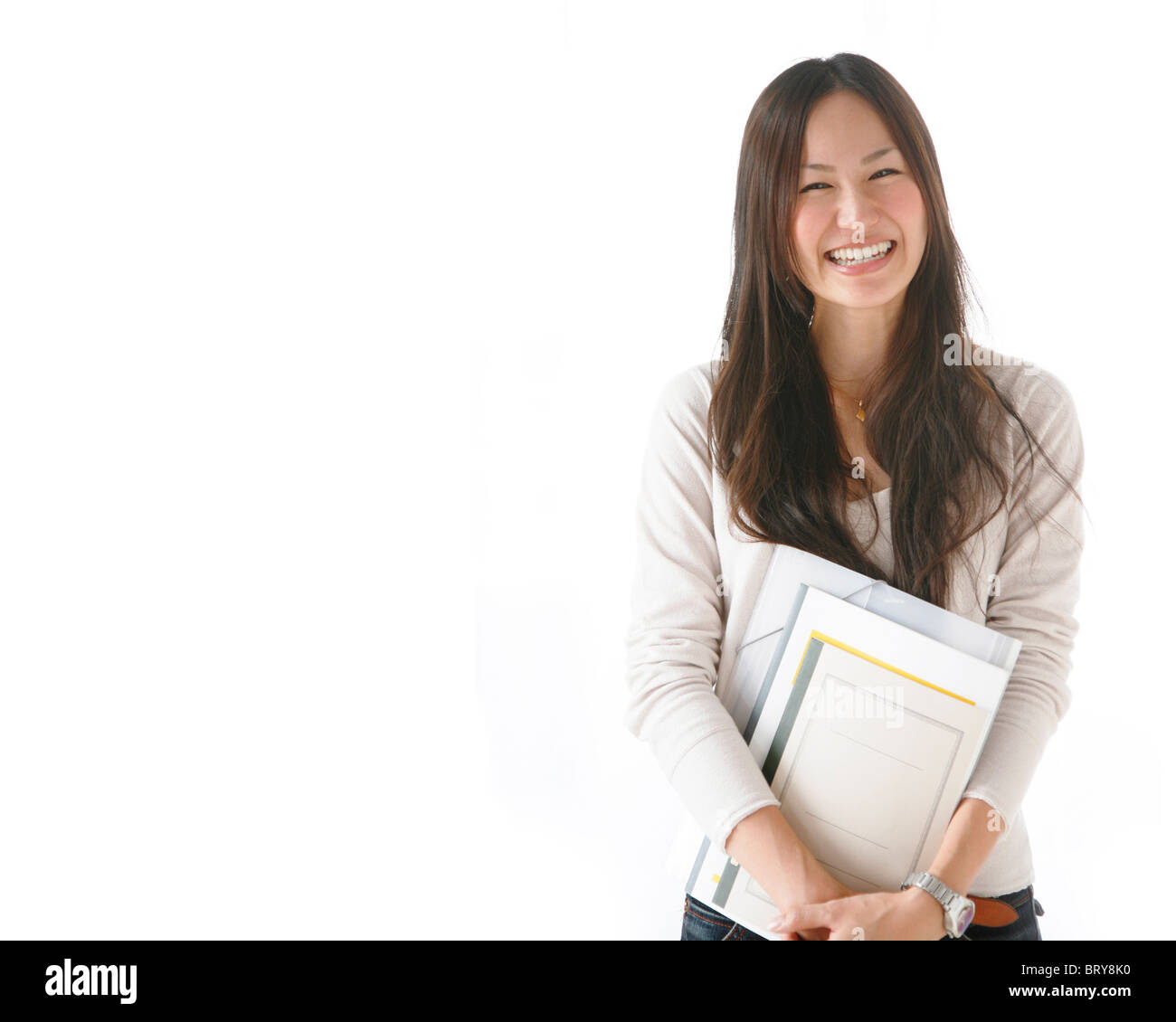 Young Woman Holding Notebooks Stock Photo