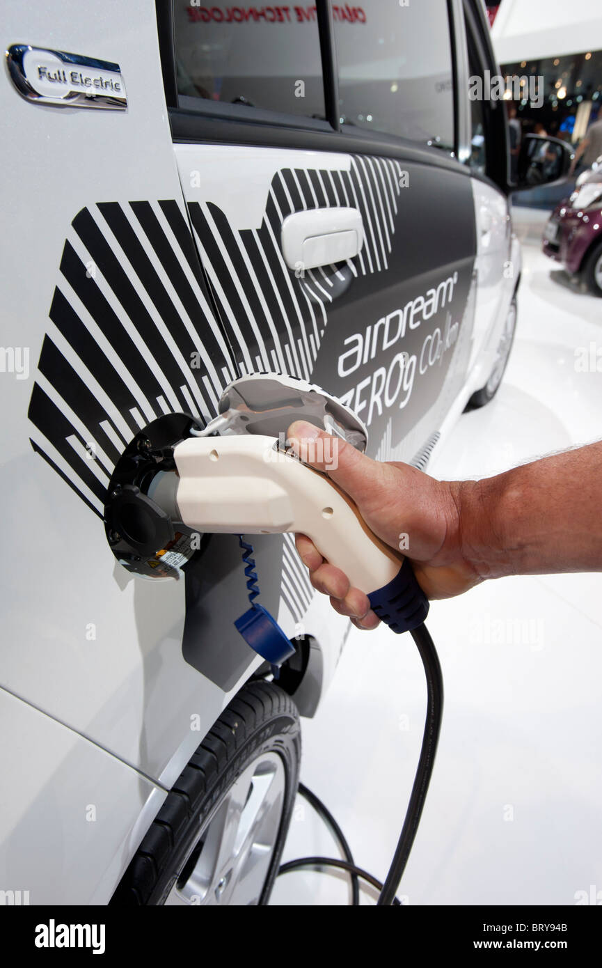 Citroen electric ION car being recharged using plug-in socket at Paris Motor Show 2010 Stock Photo