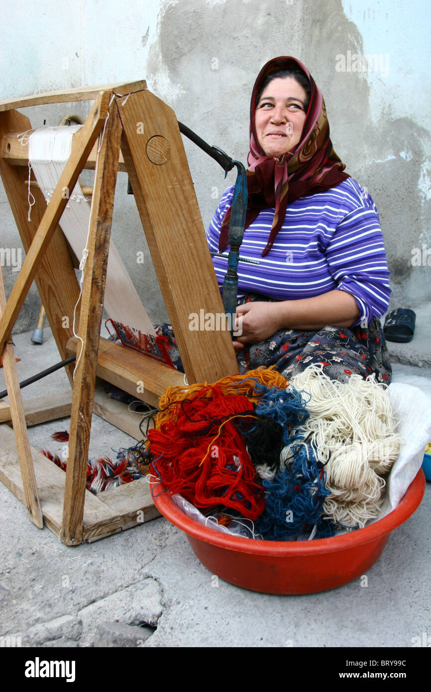 A female turkish sitting down weaving in Burdur/Southern Turkey Stock