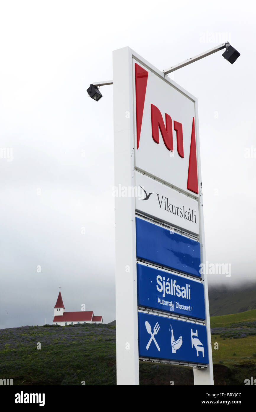 N1 SERVICE STATION WITH A CHURCH IN THE BACKGROUND, COASTAL TOWN OF VIK