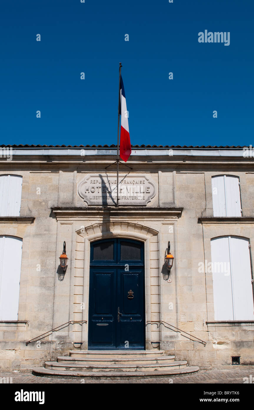 Hotel de Ville (Town Hall) with French flag, St Emilion, Bordeaux region, France Stock Photo