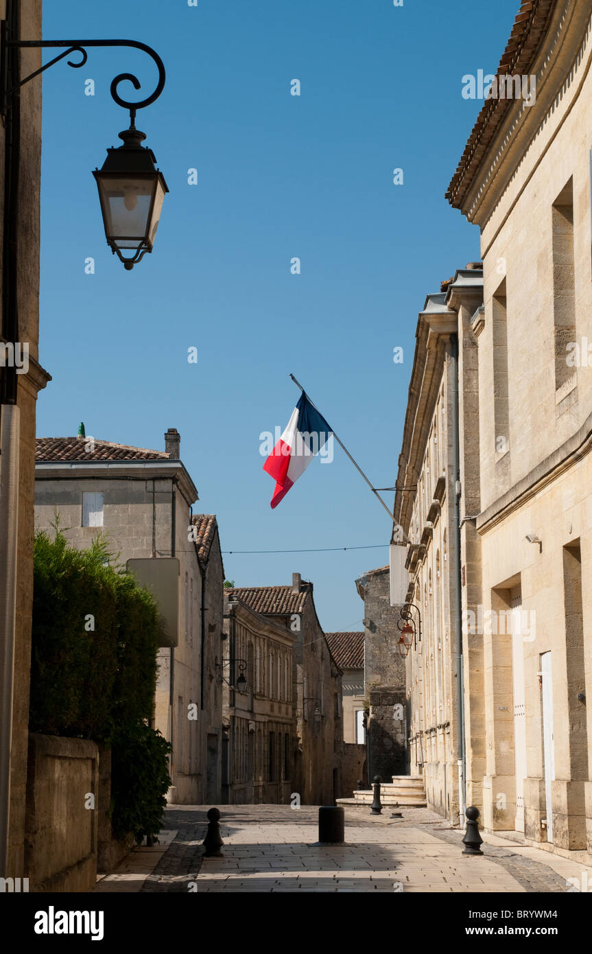 Hotel de Ville (Town Hall) with French flag, St Emilion, Bordeaux region, France Stock Photo