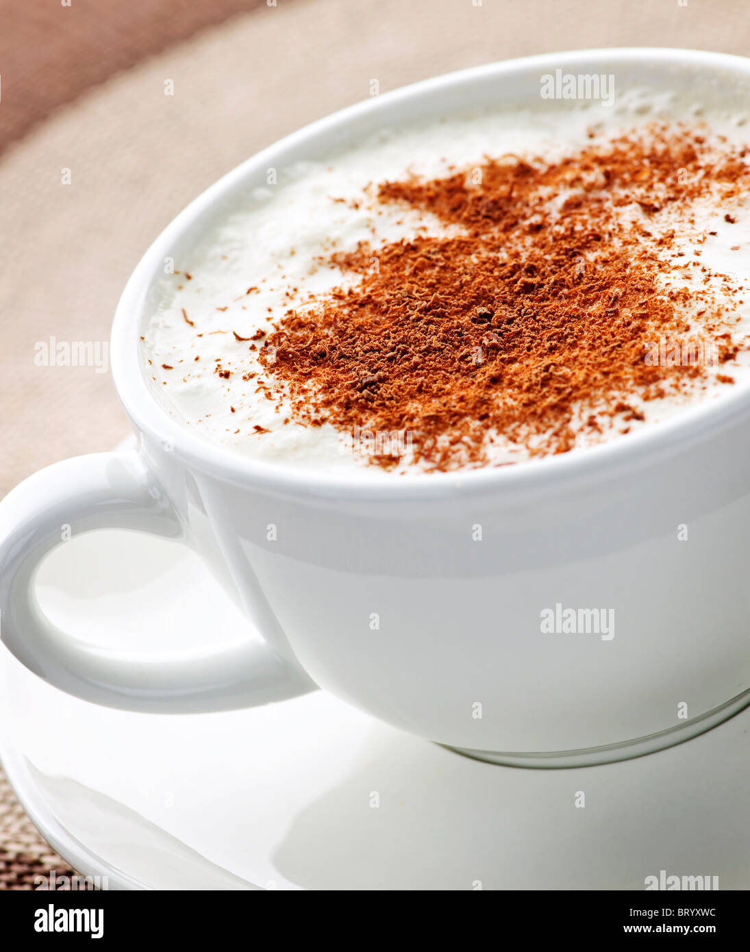 Cappuccino or latte coffee in cup with frothed milk and cookies Stock Photo