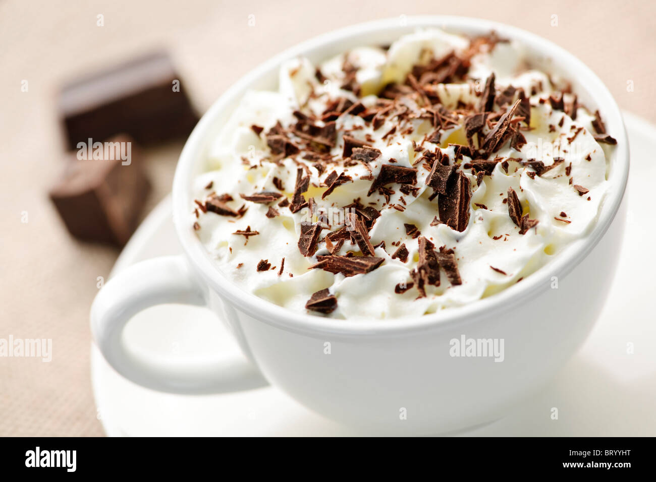 Cup of hot cocoa with shaved chocolate and whipped cream Stock Photo