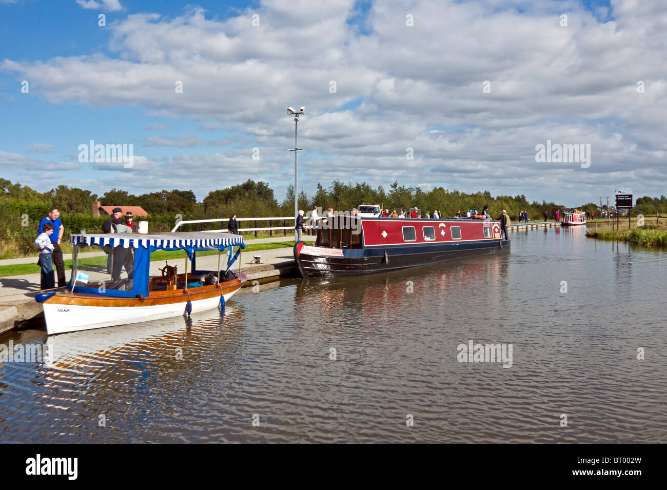 Canal boats arriving at the locks at the Union Canal near the junction with the Forth & Clyde Canal at Falkirk Wheel Stock Photo