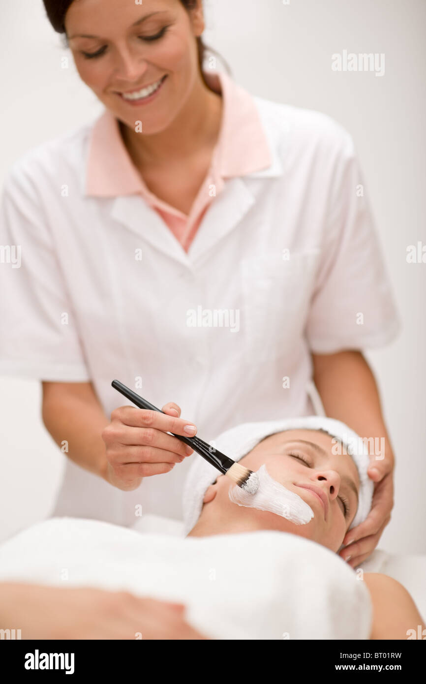 Facial mask - woman at beauty salon getting treatment Stock Photo