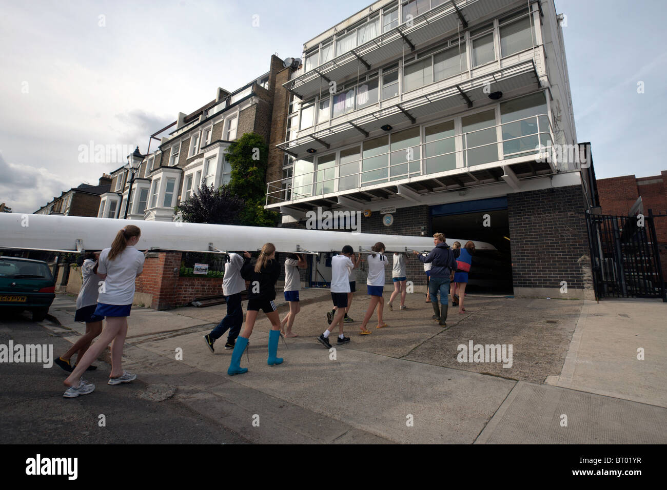 rowing boat being taken ashore in london Stock Photo Alamy