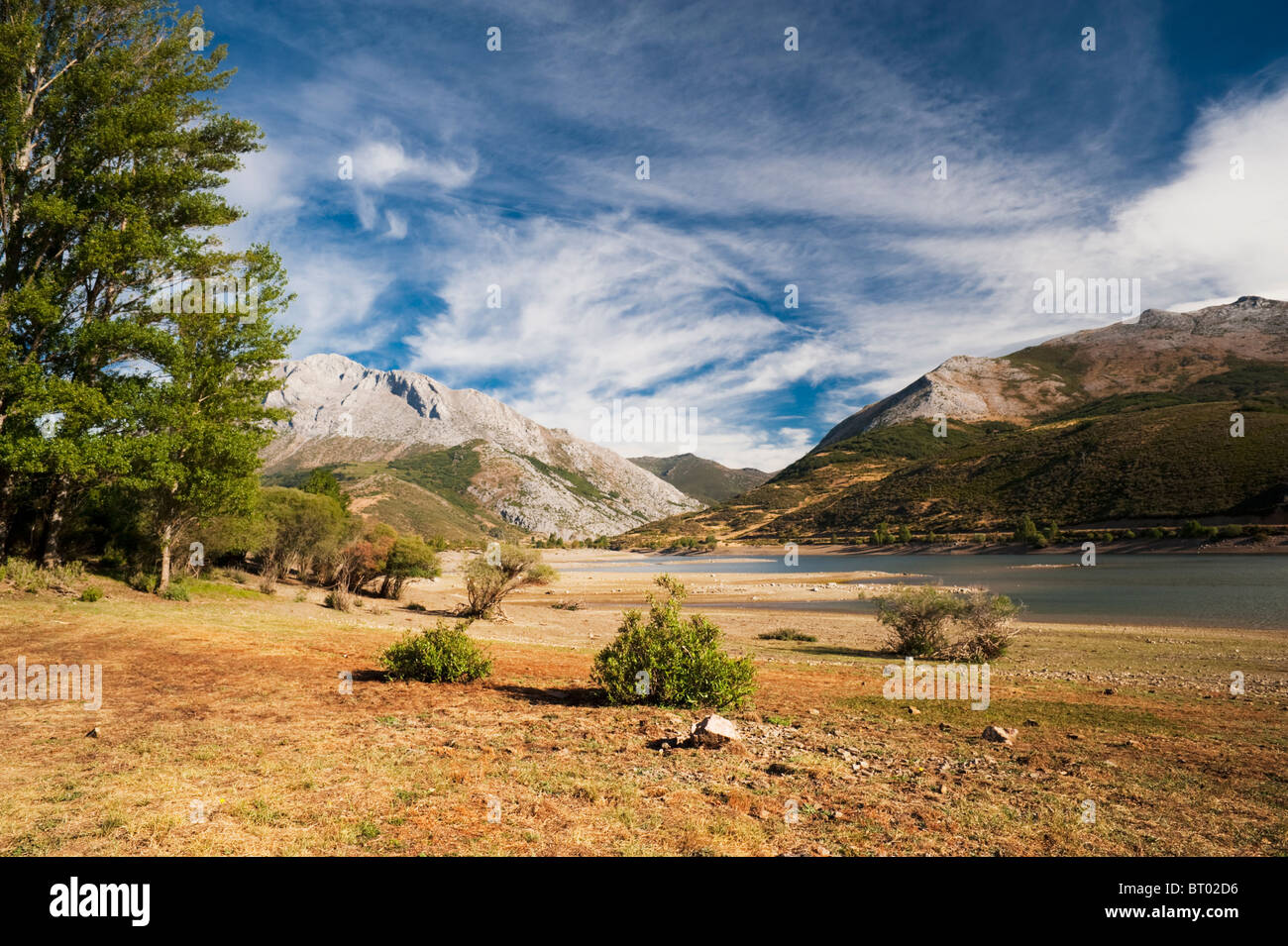 The partly dry Camporedondo Reservoir in the Palentine Mountain range of northern Spain Stock Photo