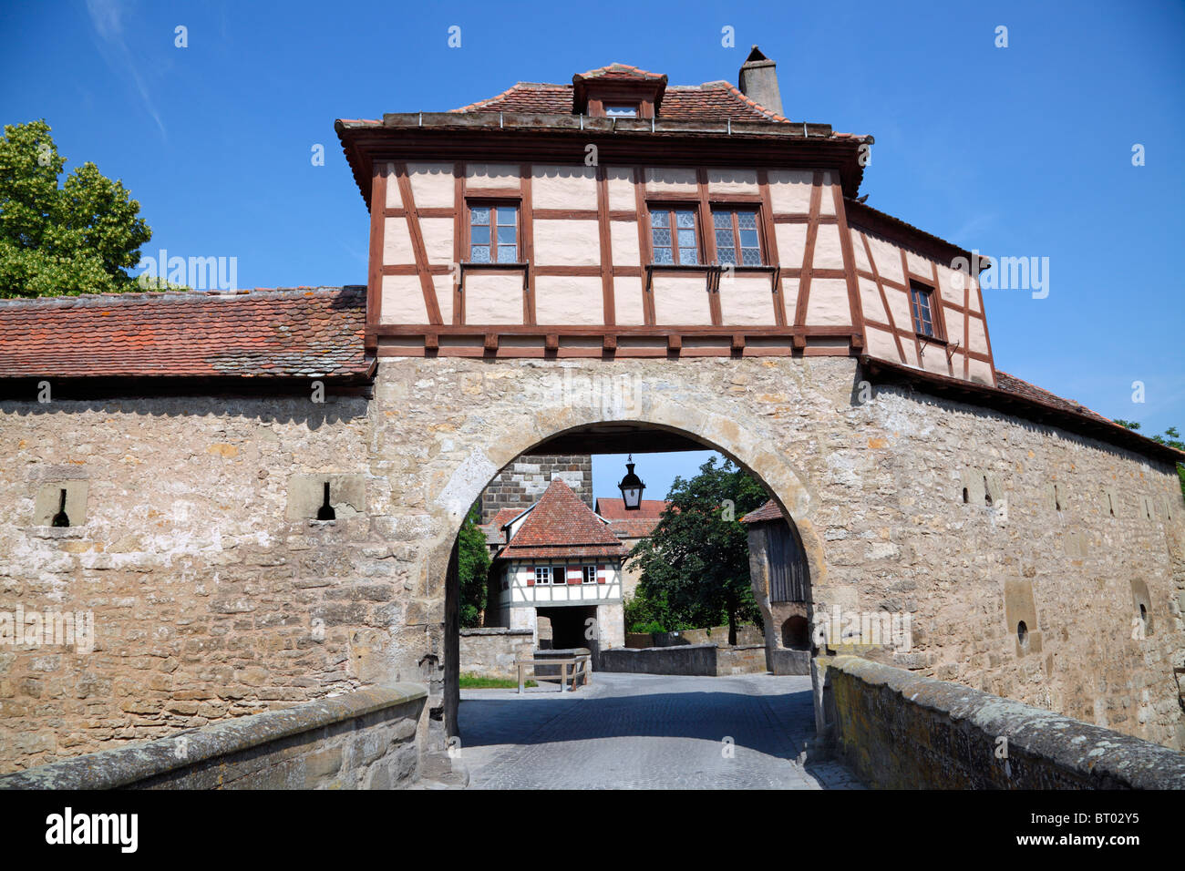 Röder Bastion in the medieval city ring wall around Rothenburg ob der Tauber, Germany. Röder Tower is behind the bastion. Stock Photo