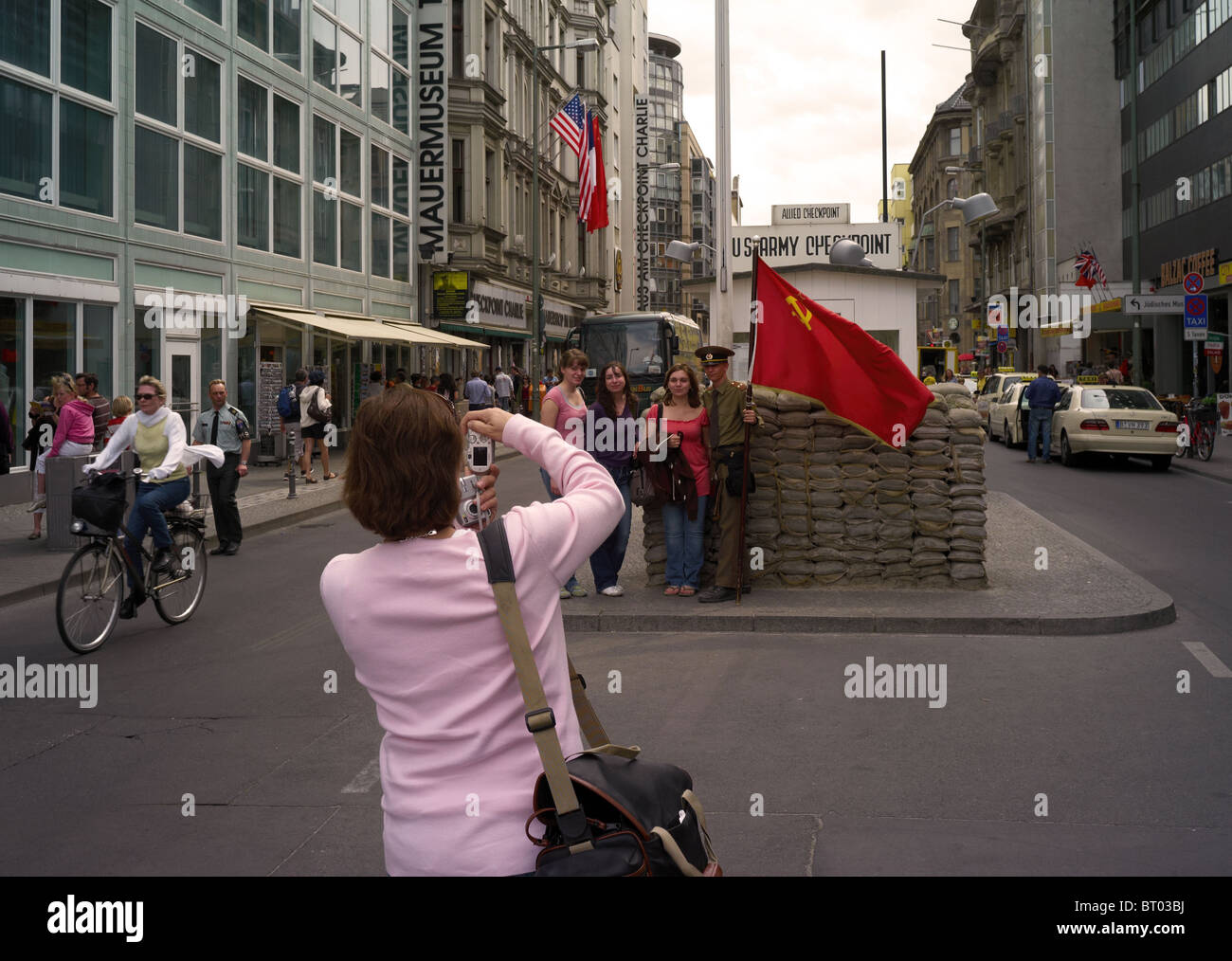 Tourists at Checkpoint Charlie, Berlin, Germany Stock Photo