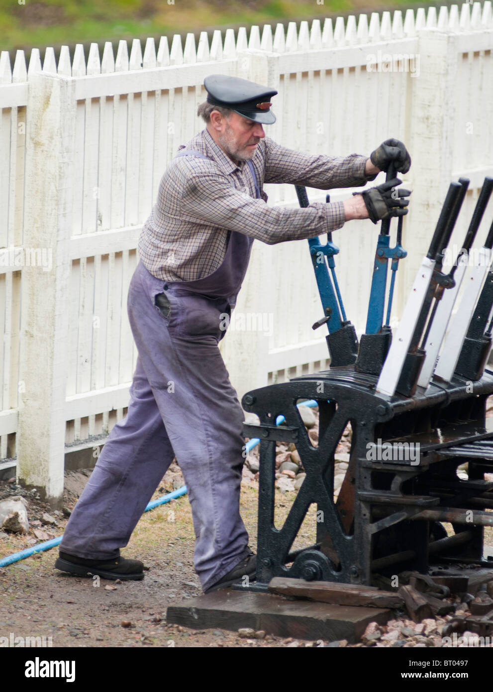 Signalman pulling levers for the historic steam train Number 828 at