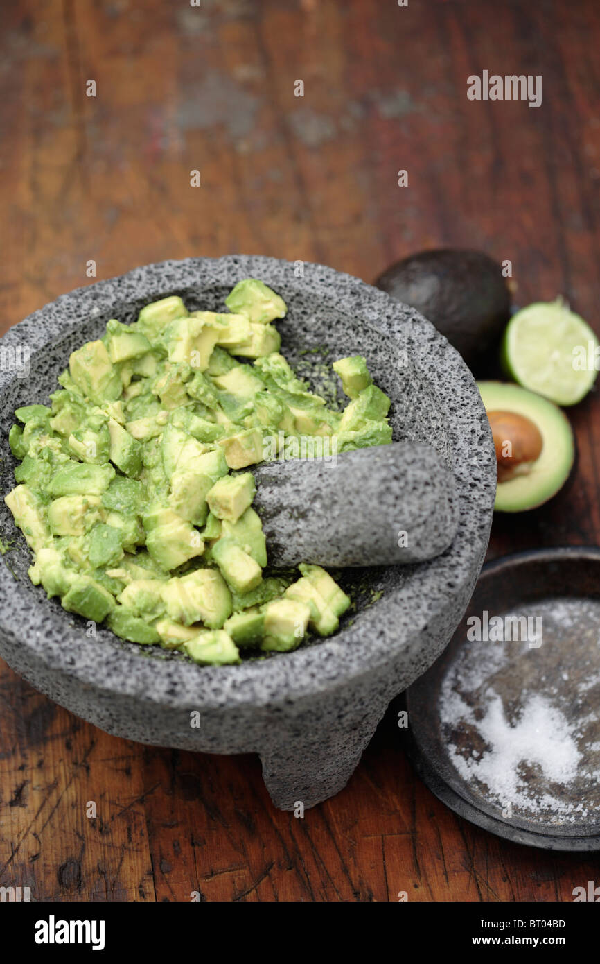 Guacamole in mortar with pestle Stock Photo Alamy