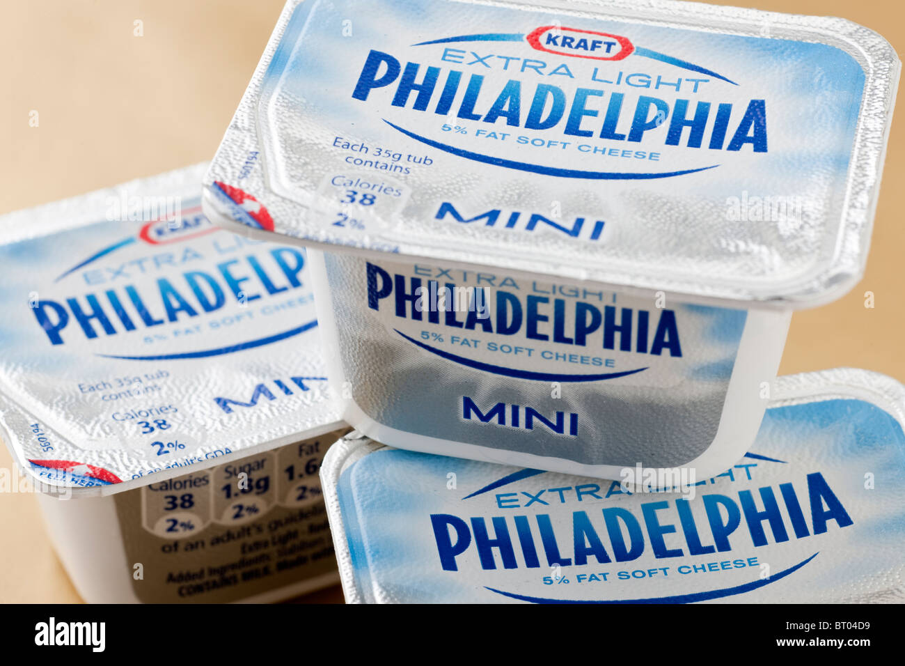 Three mini cartons of 5% low fat Philadelphia light cream soft cheese Stock Photo