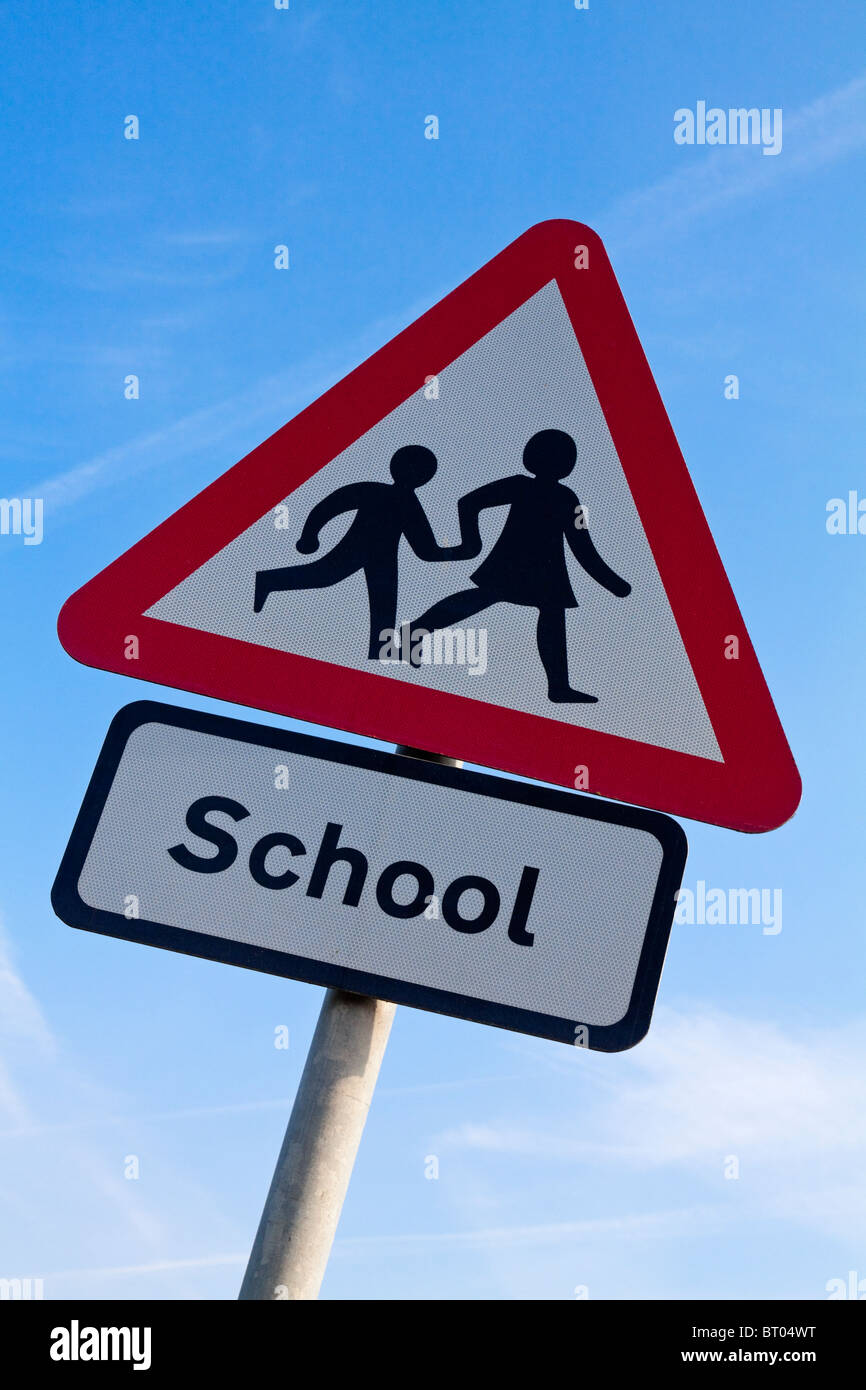 Close up view of School warning triangle sign used to warn motorists and other road traffic in the UK Stock Photo