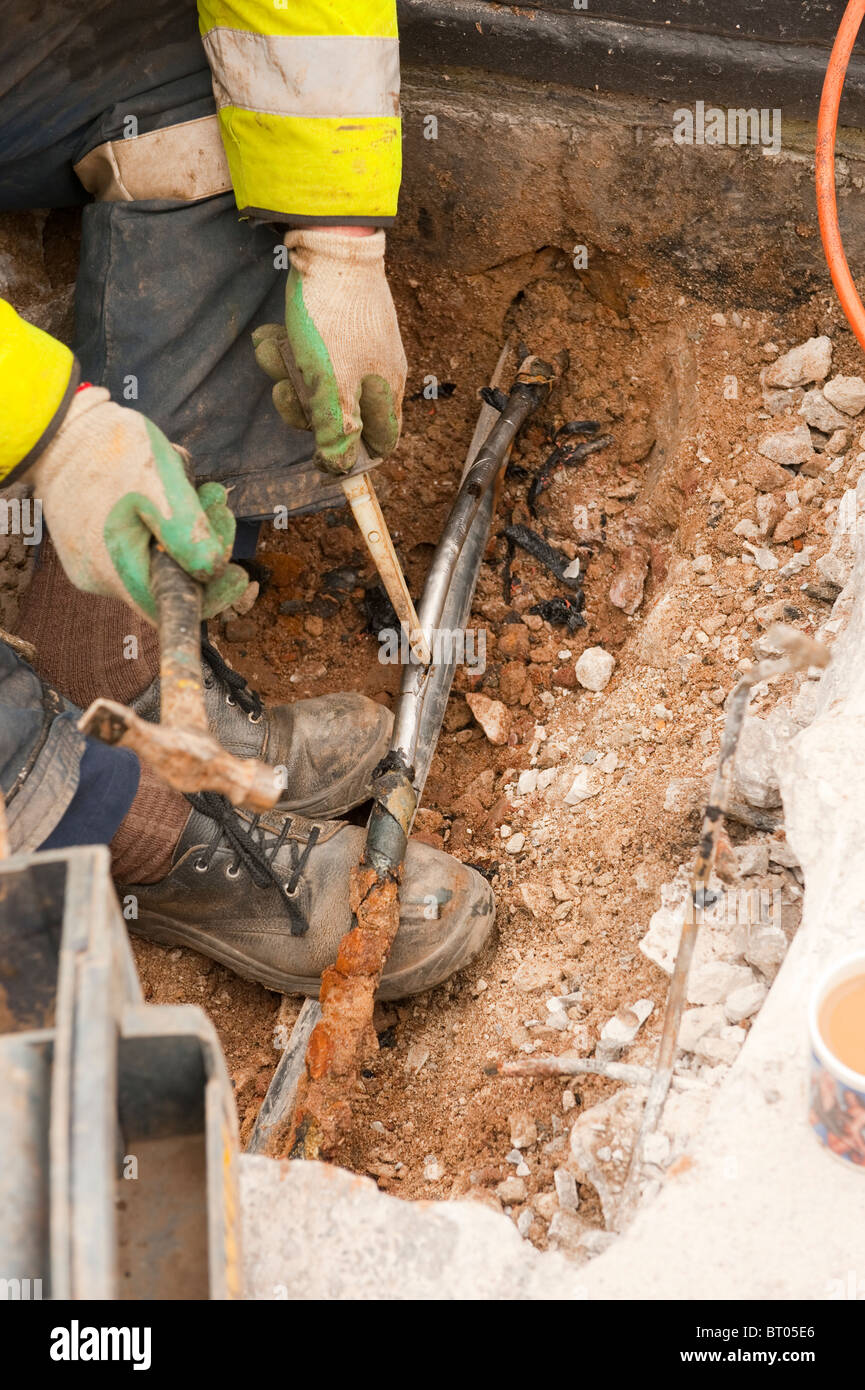 Underground steel armoured high voltage cable being isolated / cut and stripped to cut power to