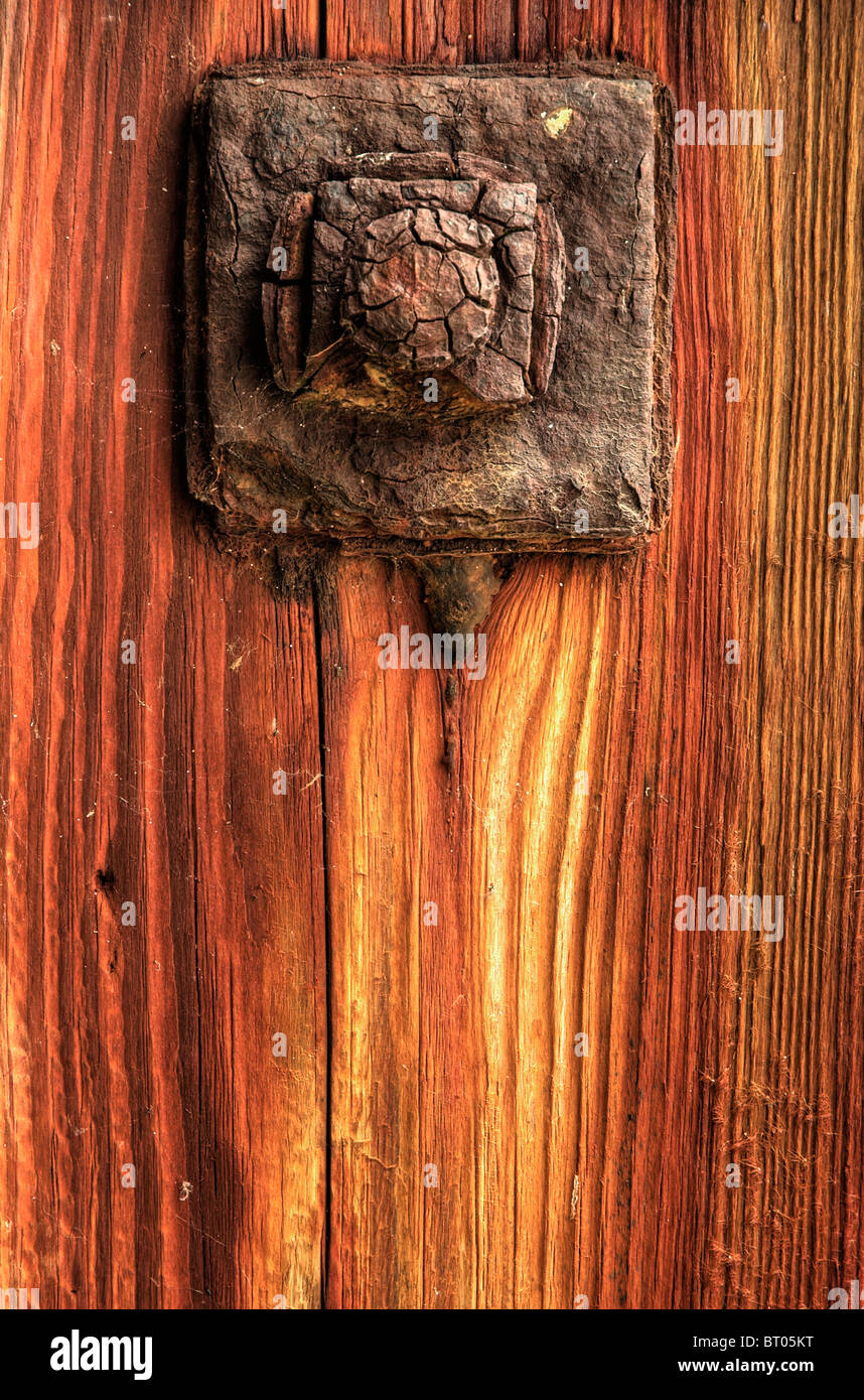 Rusty bolt in aged woord Stock Photo