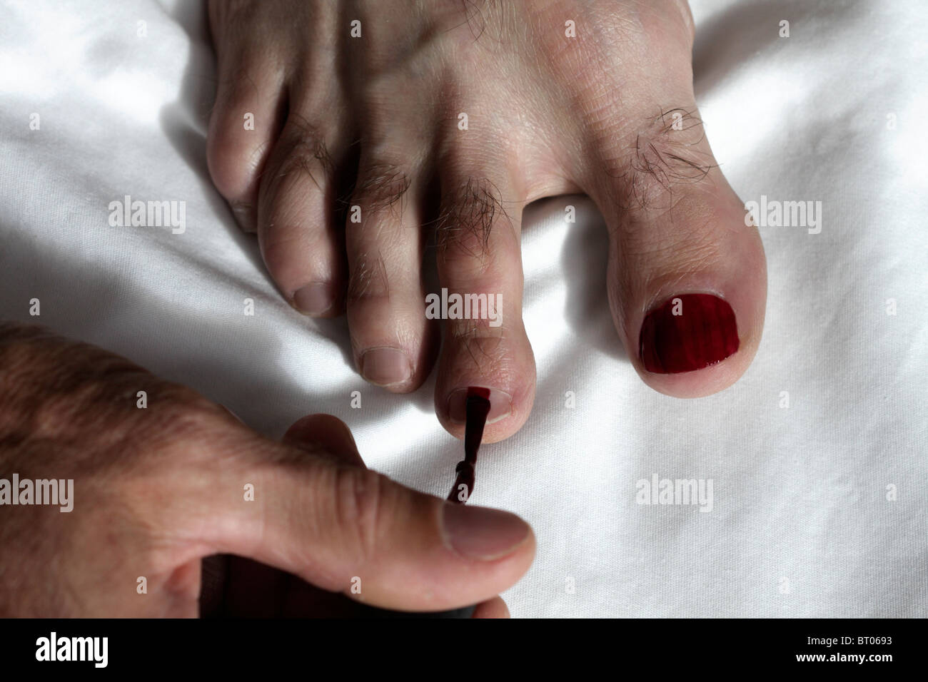 Man painting his toe nails Stock Photo Alamy