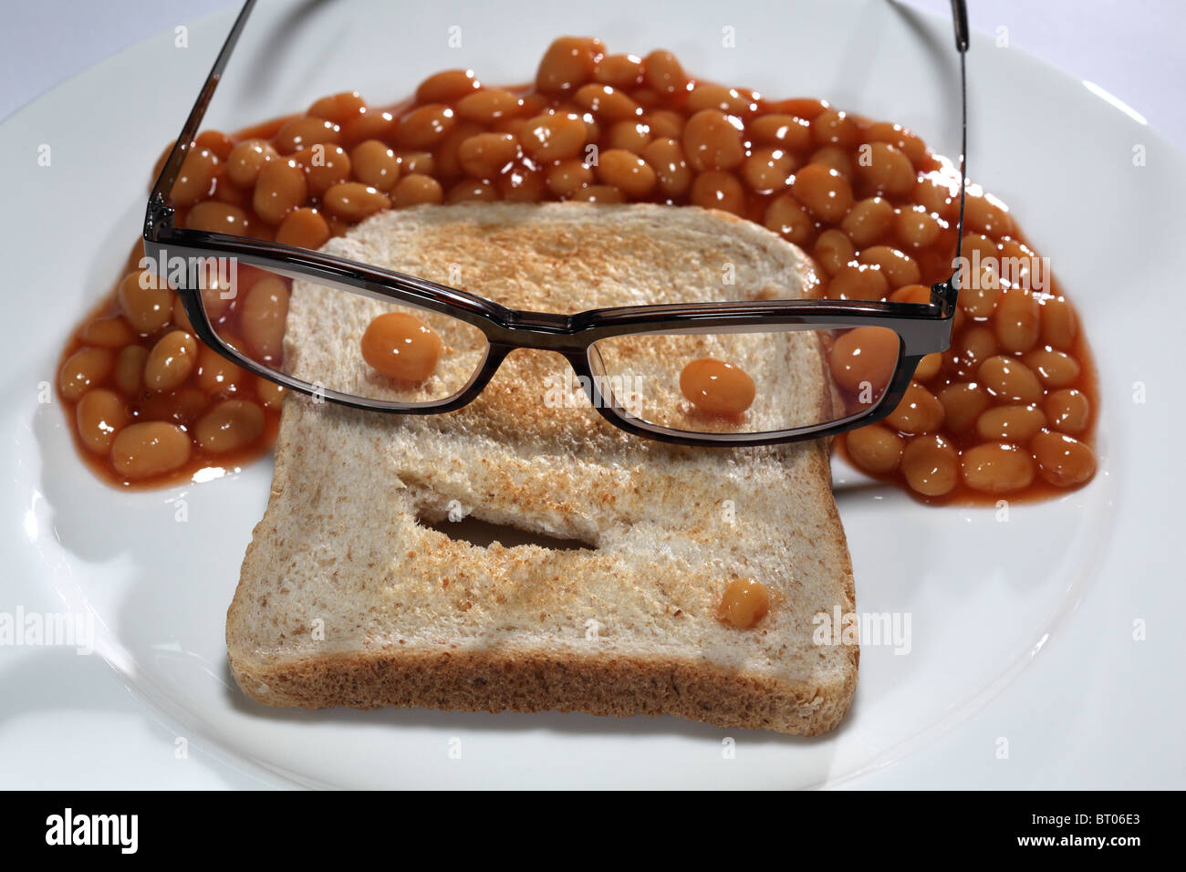 baked beans toast bread funny face glasses Stock Photo - Alamy