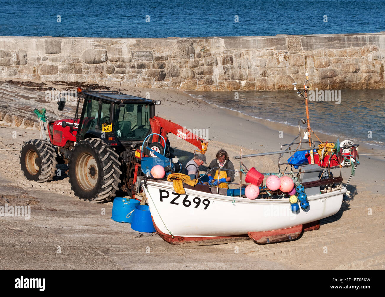 fishermen land their catch at sennen cove in cornwall, uk Stock Photo