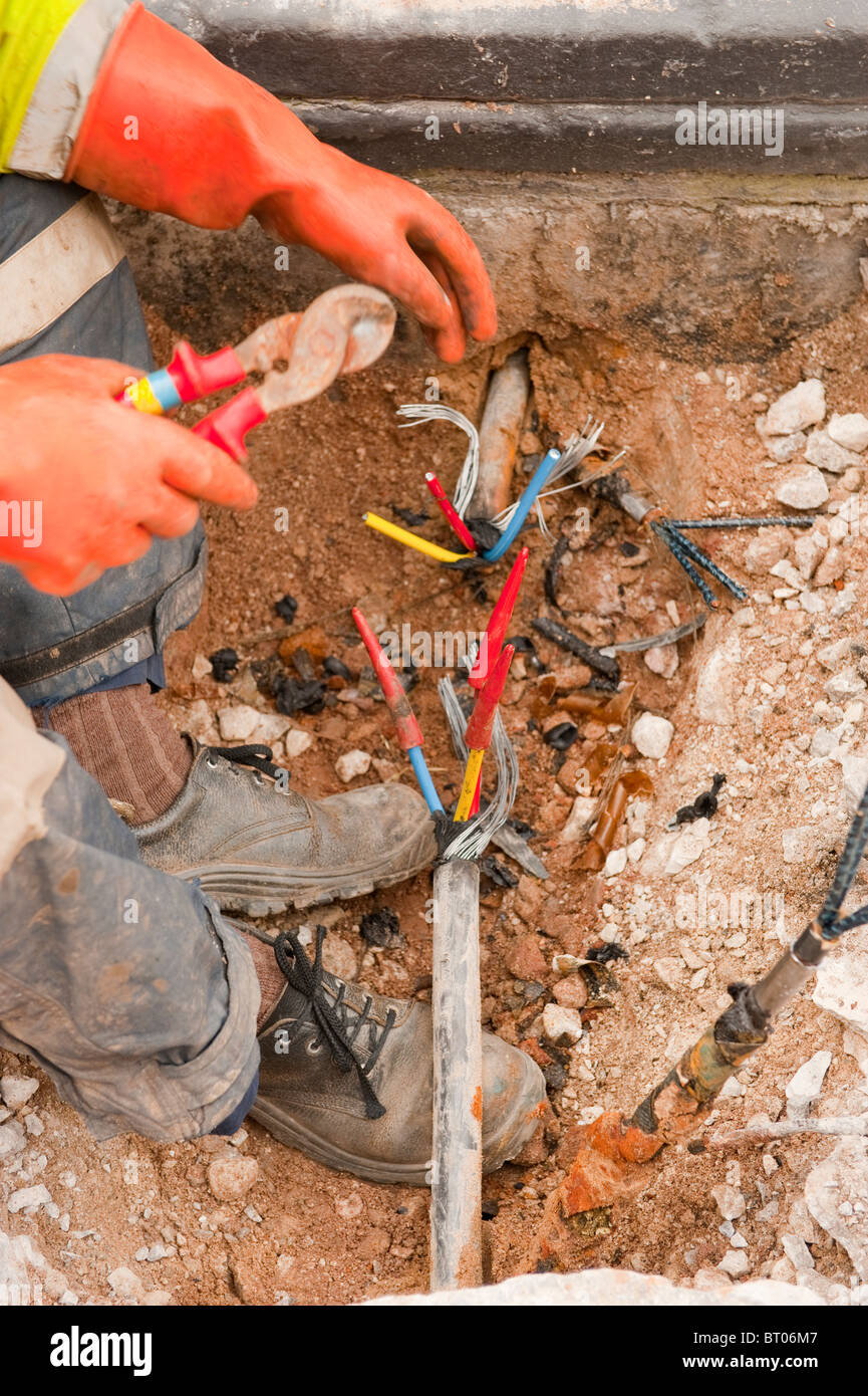 Underground steel armoured high voltage cable being isolated / cut and stripped to cut power to building. SEE WHOLE SERIES Stock Photo