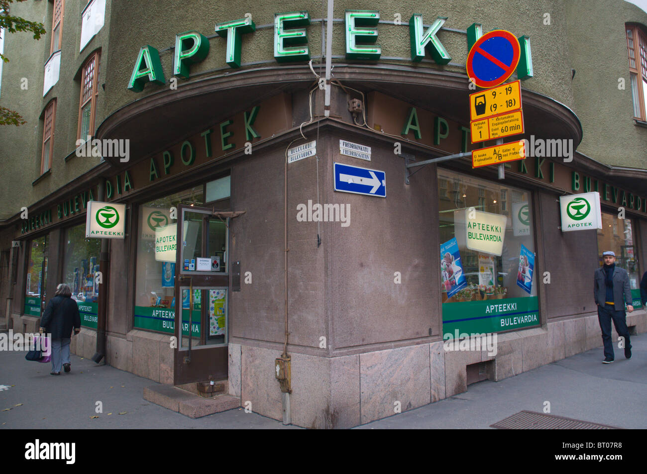 Bulevardi and Fredrikinkatu street corner with pharmacy and signs central Helsinki Finland Europe Stock Photo