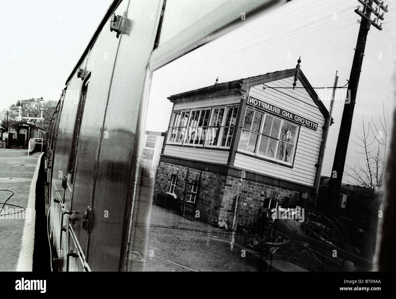 The Pitsford and Brampton signalbox is reflected in a train carriage window at the Northampton & Lamport Railway. Stock Photo