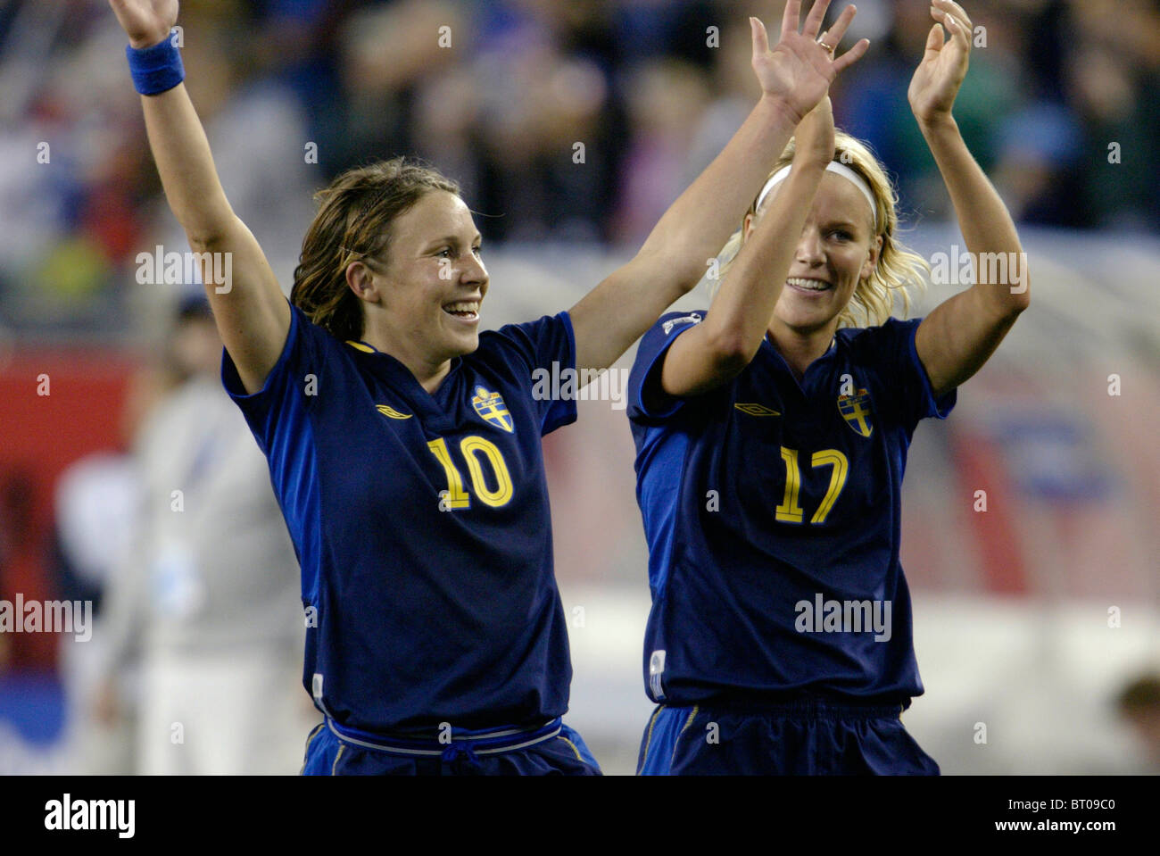 Sweden players Hanna Ljungberg (10) and Anna Sjoestrom (17) celebrate after their victory over Brazil in 2003 Women's World Cup. Stock Photo