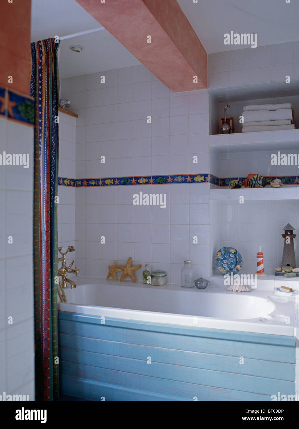 Blue Paneled Bath In White Tiled Cottage Bathroom With