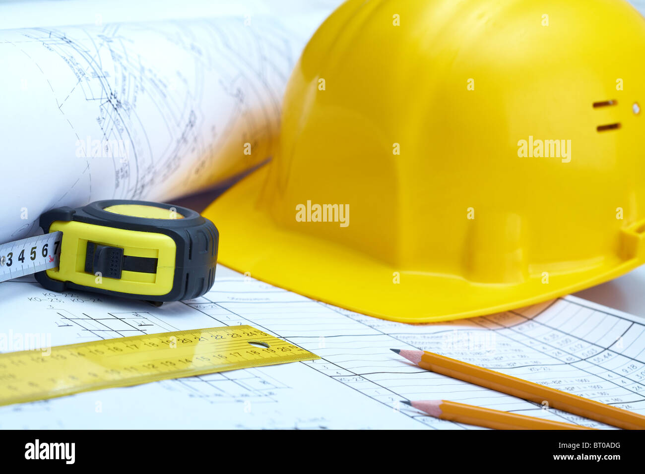 Photo of instruments of builder over plan of house Stock Photo