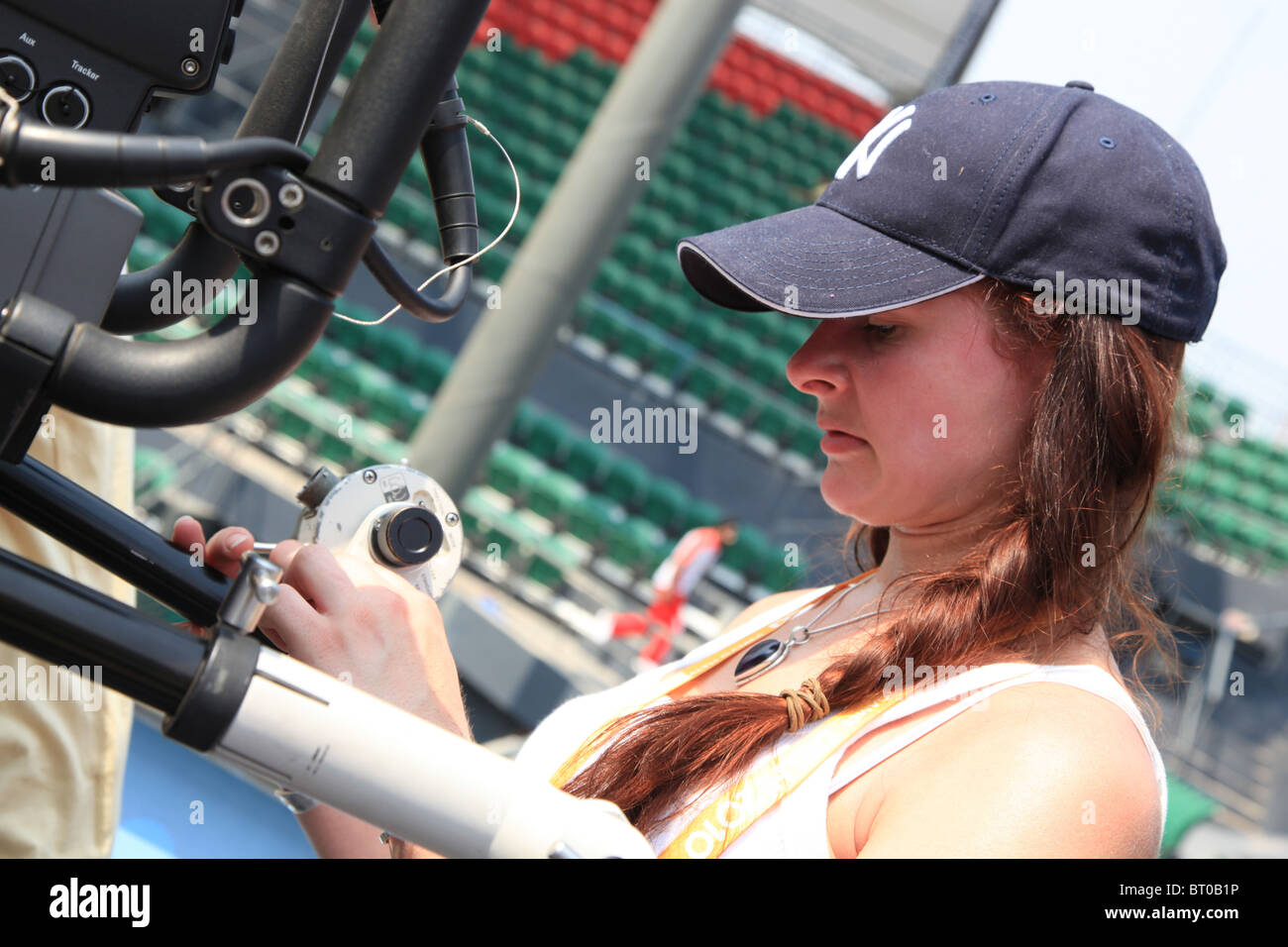 Female camera operator at the tennis stadium, Commonwealth Games, Delhi 2010 Stock Photo