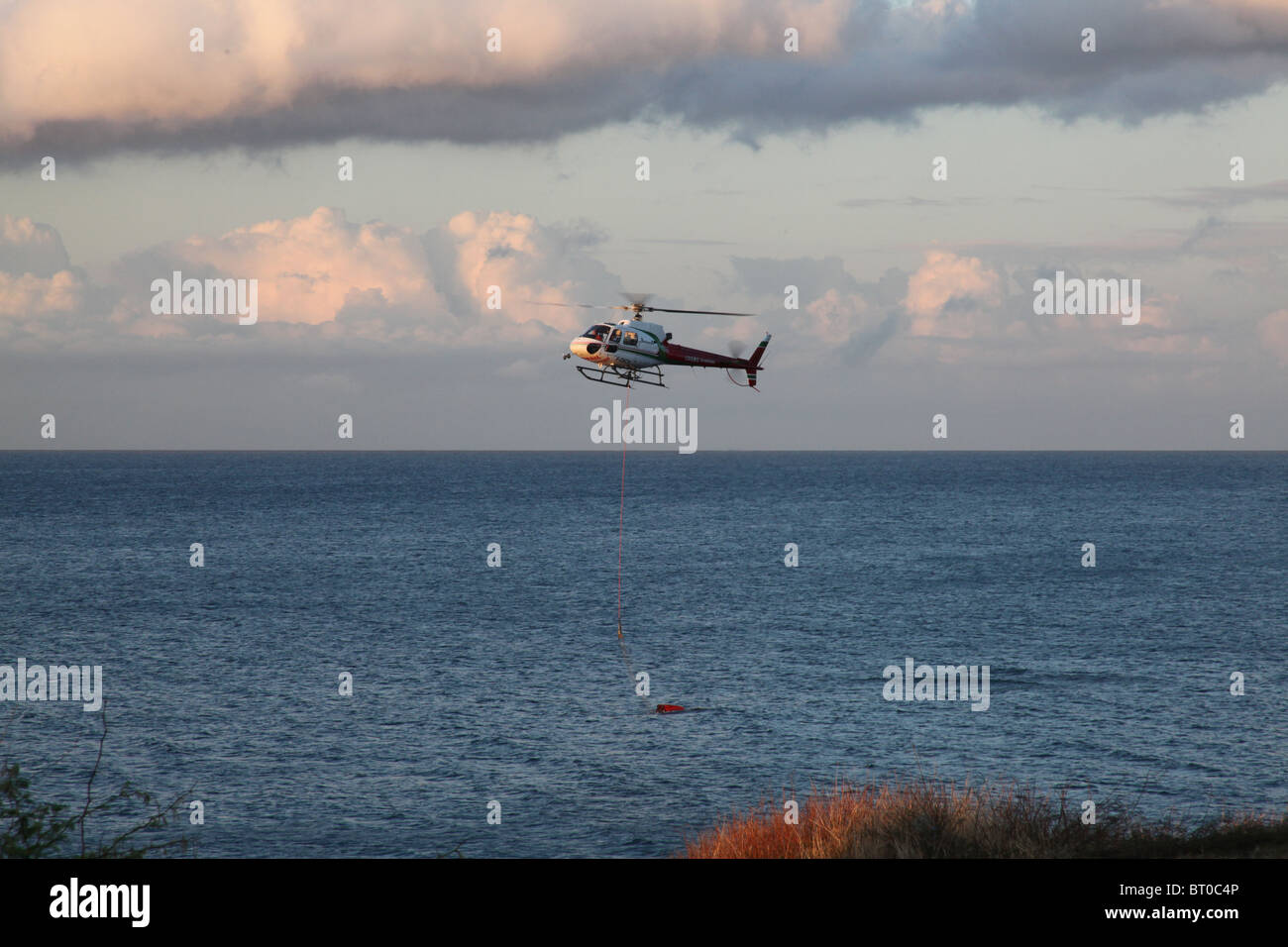 HELICOPTER picking water in Reunion island Stock Photo Alamy