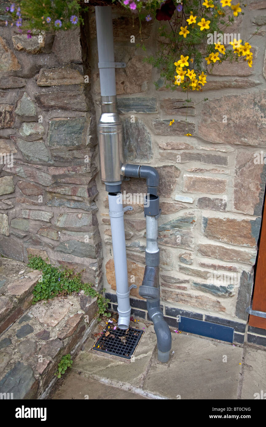 Wisey stainless steel rain water diverter and filter installed in downpipe UK Stock Photo