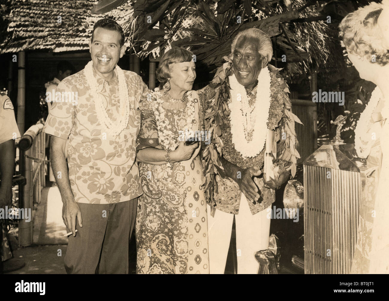 Duke Kahanamoku with his manager Kimo Wilder McVay and Duke's wife, Nadine Alexander standing next to Duke's beloved Rolls Royce Stock Photo